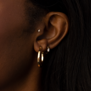 BAGUETTE DIAMOND AND GOLD HUGGIE EARRINGS